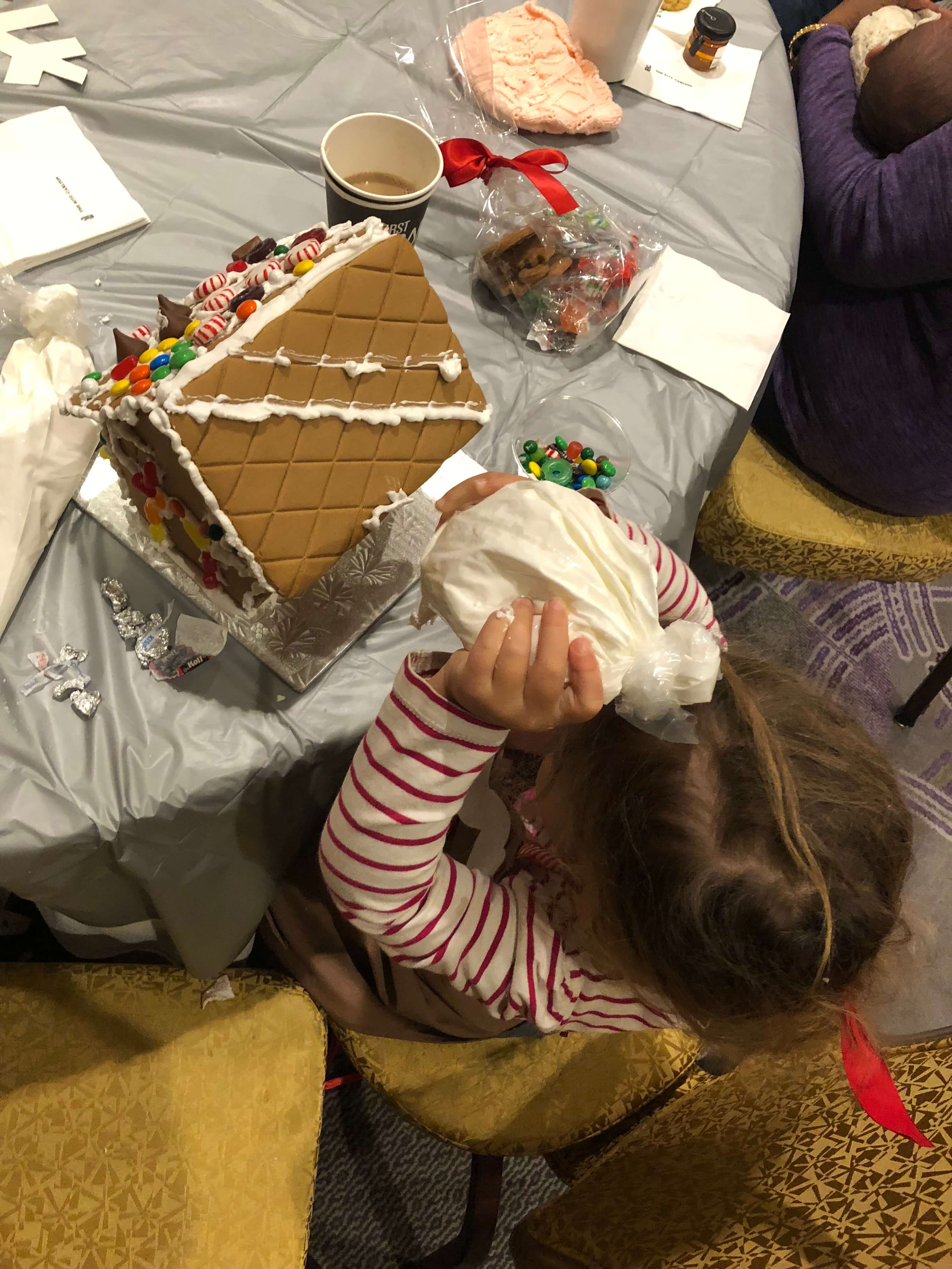 gingerbread house decorating adding squeezing icing westchester events