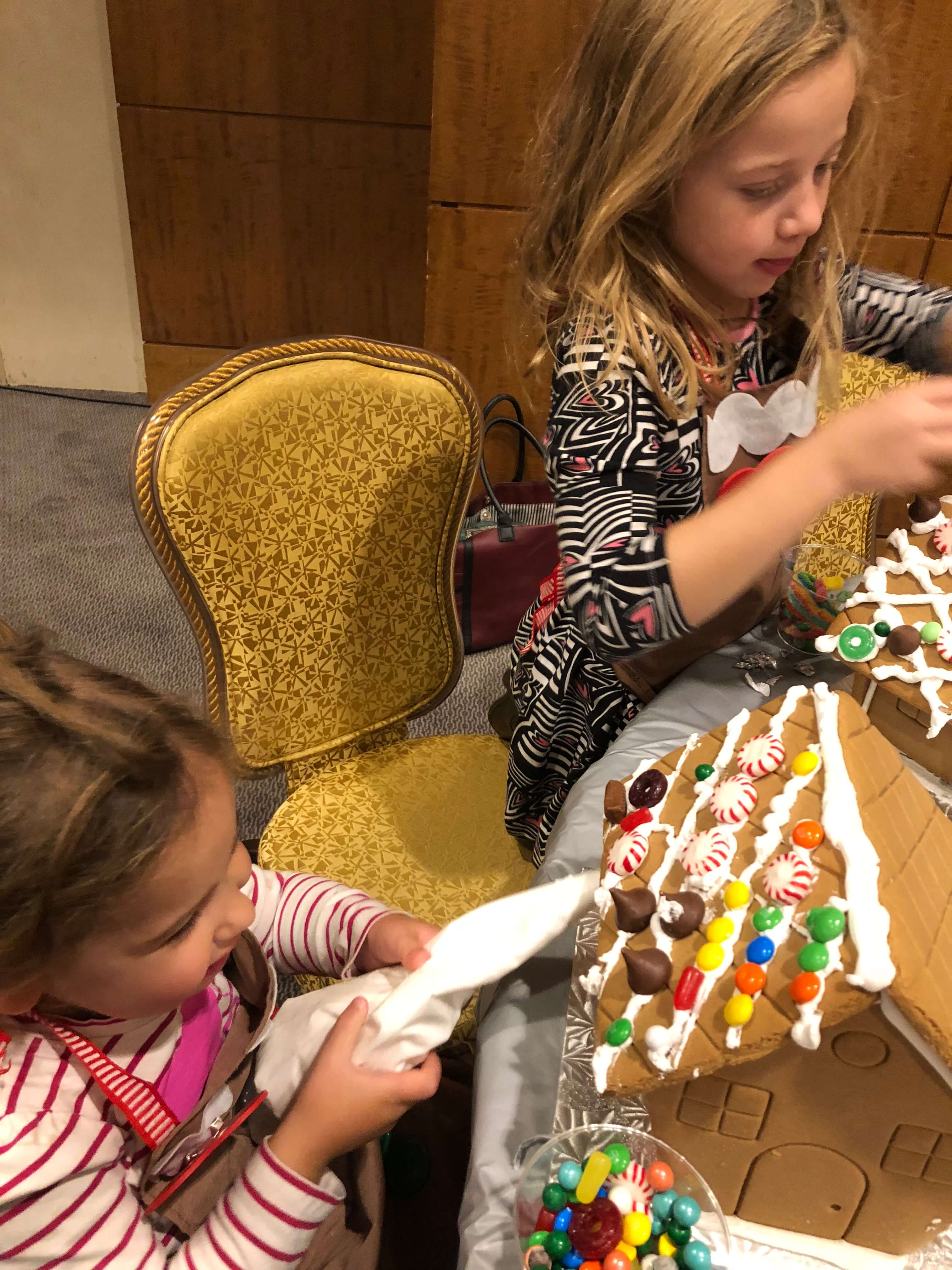 gingerbread house decorating adding icing and adding candy westchester events
