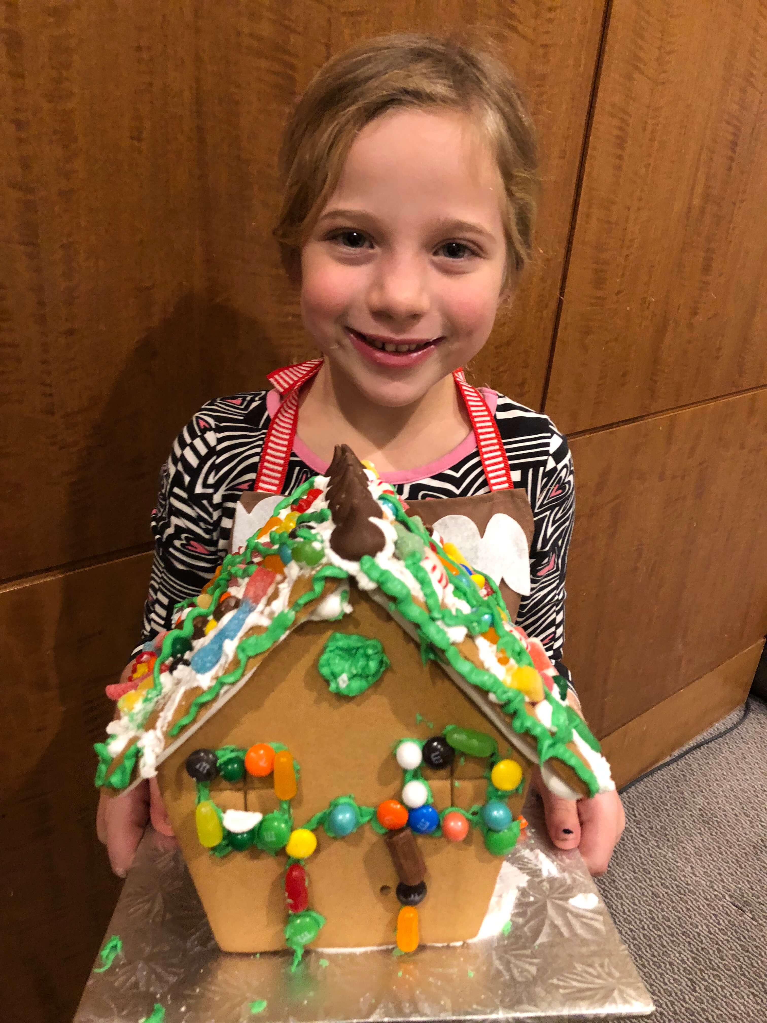 gingerbread house decorating adding icing westchester events finished house